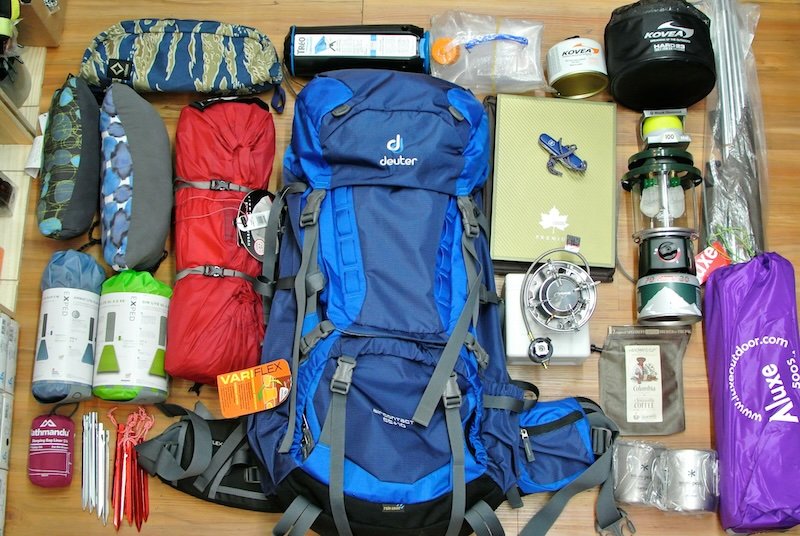 Backpackers dividing group gear at the trailhead